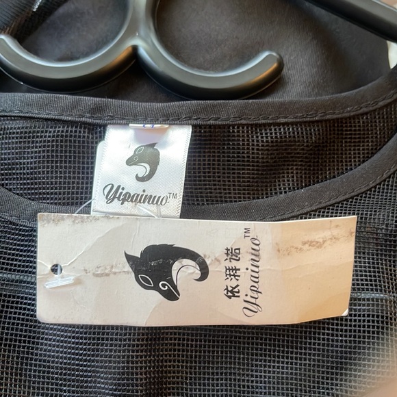 A black three quarter long sleeve women’s blouse with silk and sheer design. - Picture 7 of 7